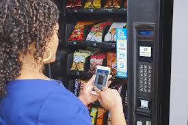 Outdoor vending machine location with customers